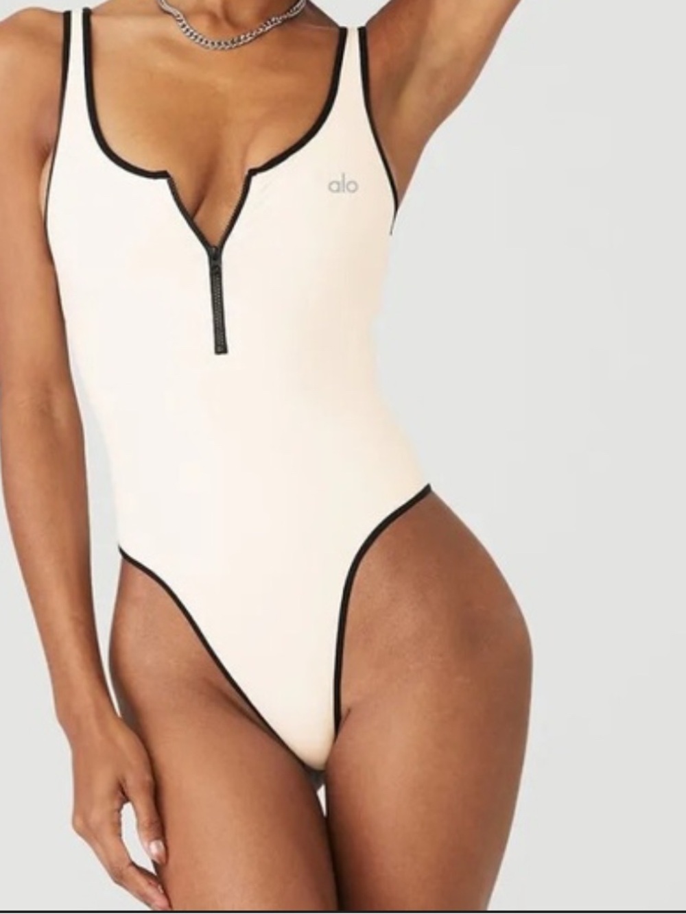 ALO Yoga Cream One-Piece Swimsuit with Black Trim and Zip Front